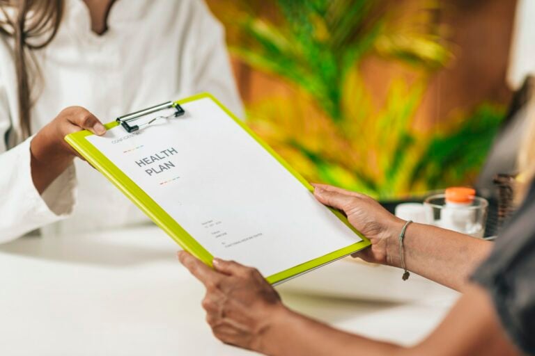 Preventive medicine, handing a personalized health plan to a client