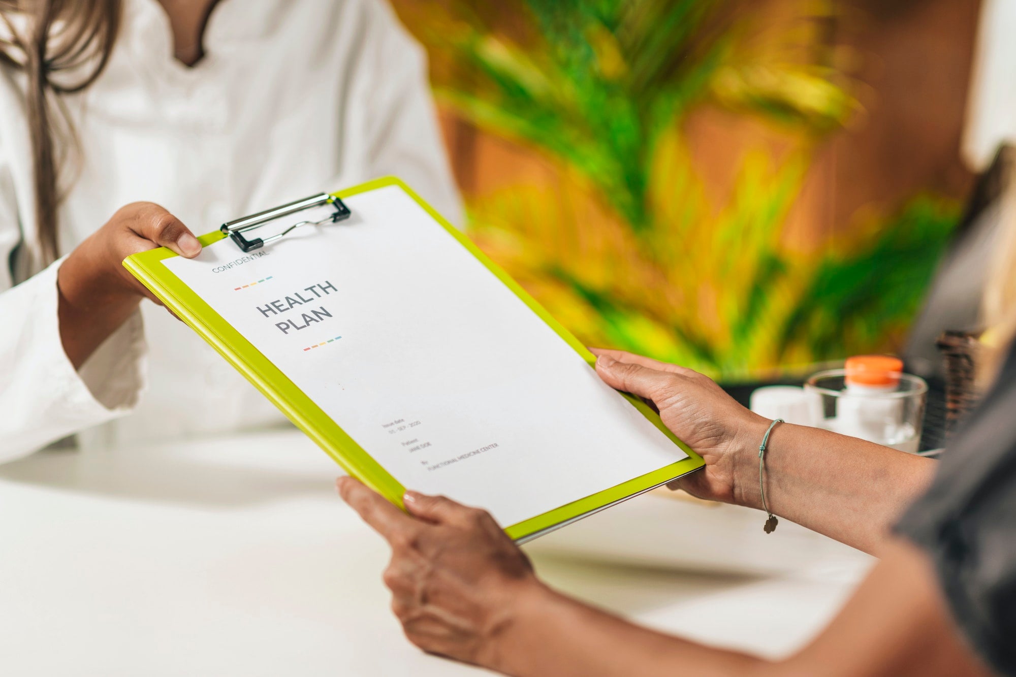 Preventive medicine, handing a personalized health plan to a client