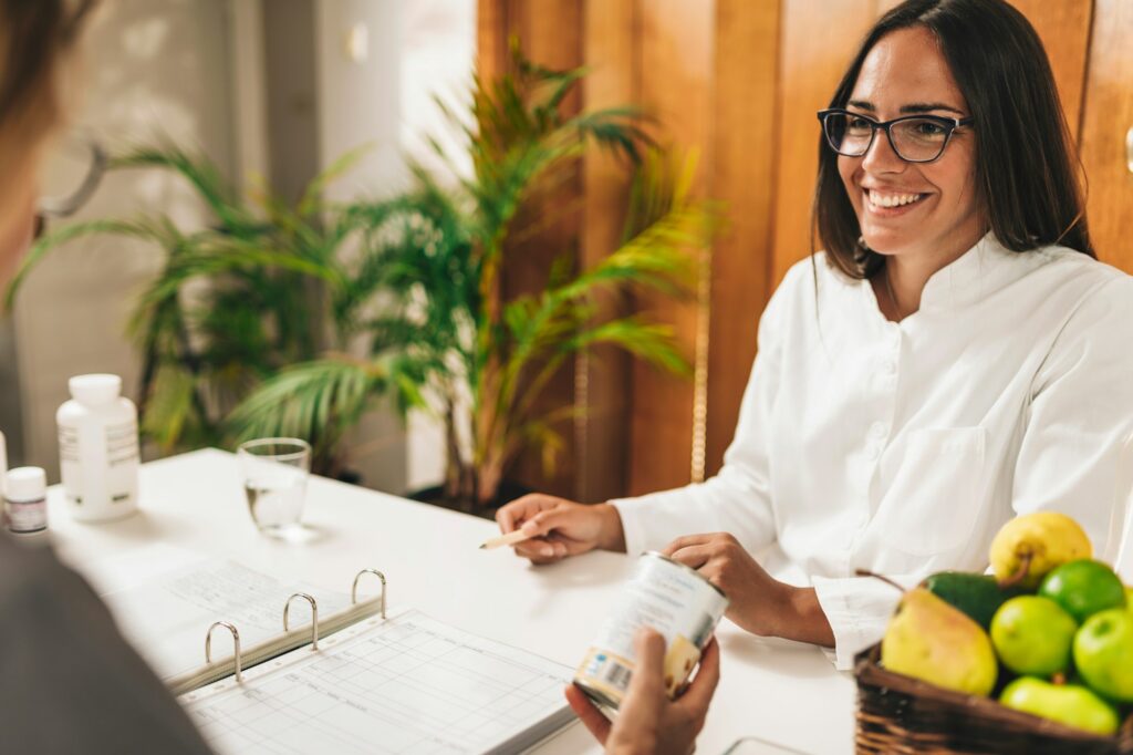 Nutritionist Talking with Patient at Weight Loss Clinic